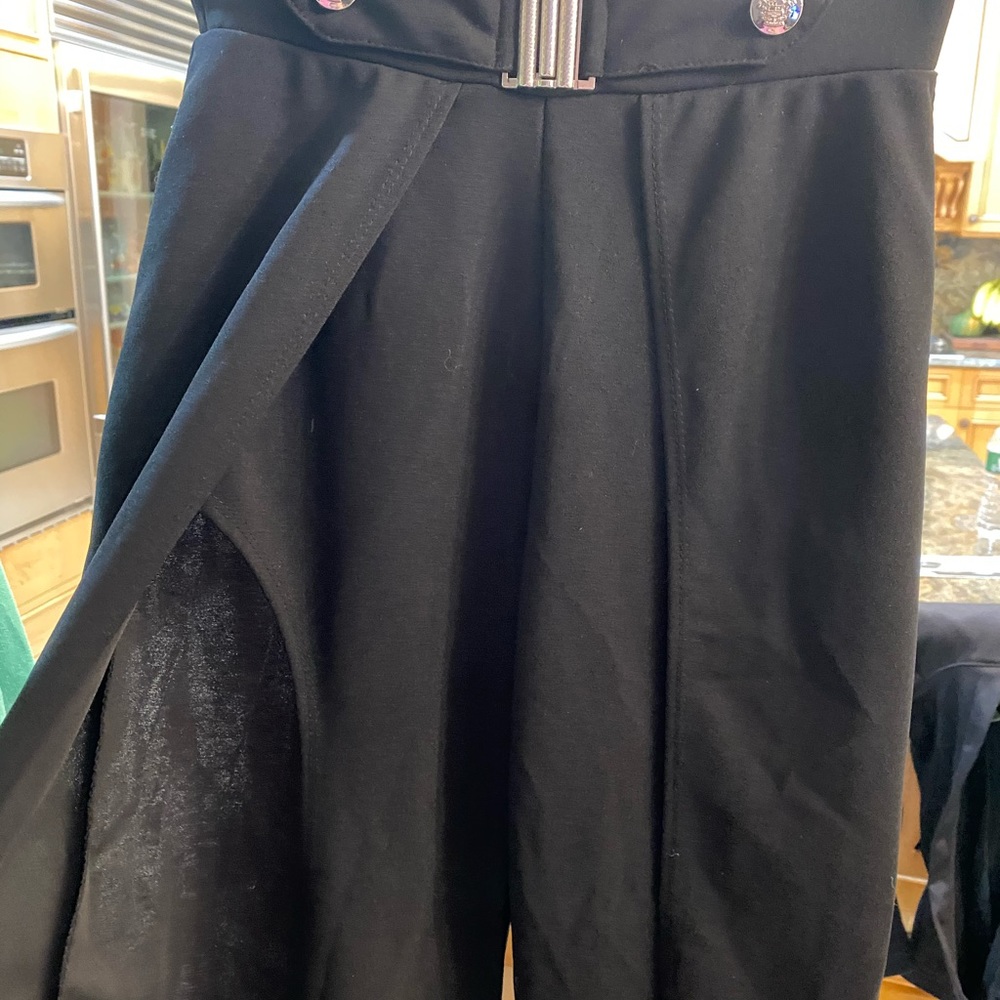 Black trousers with leg slit and belt buckle